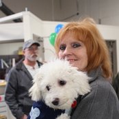 ReStore Manager, Karen Wagner, holds her dog, Ripley, the ReStore mascot.